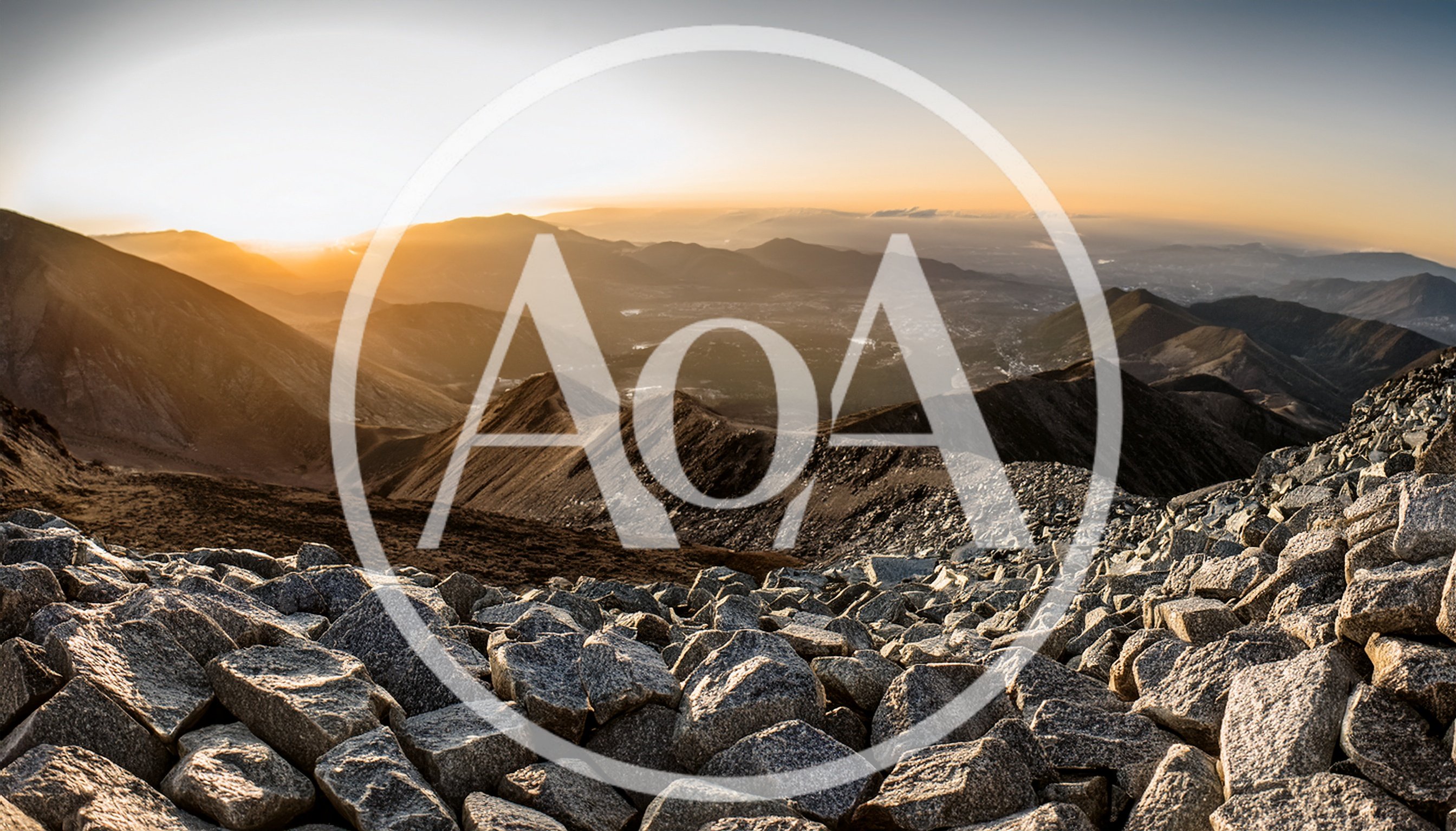 Panoramic View Of Rocky Mountain Peaks At Sunset
