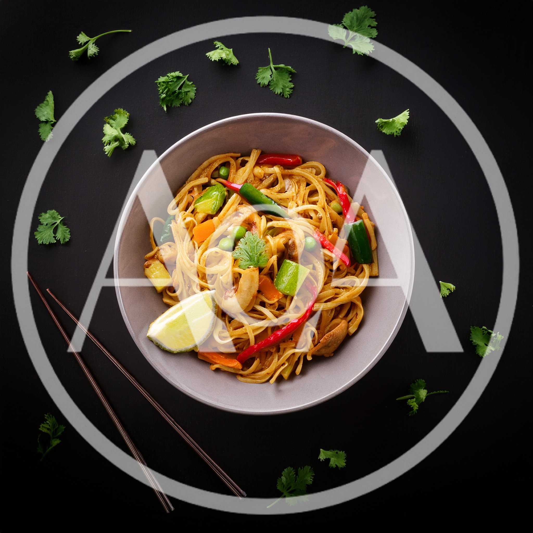 Bowl Of Pad Thai Noodles With Vegetables And Lime