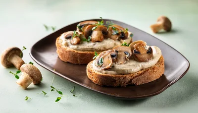 Mushroom Bruschetta Appetizers on a Brown Plate
