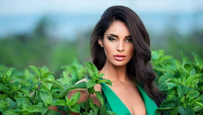 Beautiful Woman Posing In A Lush Mint Field