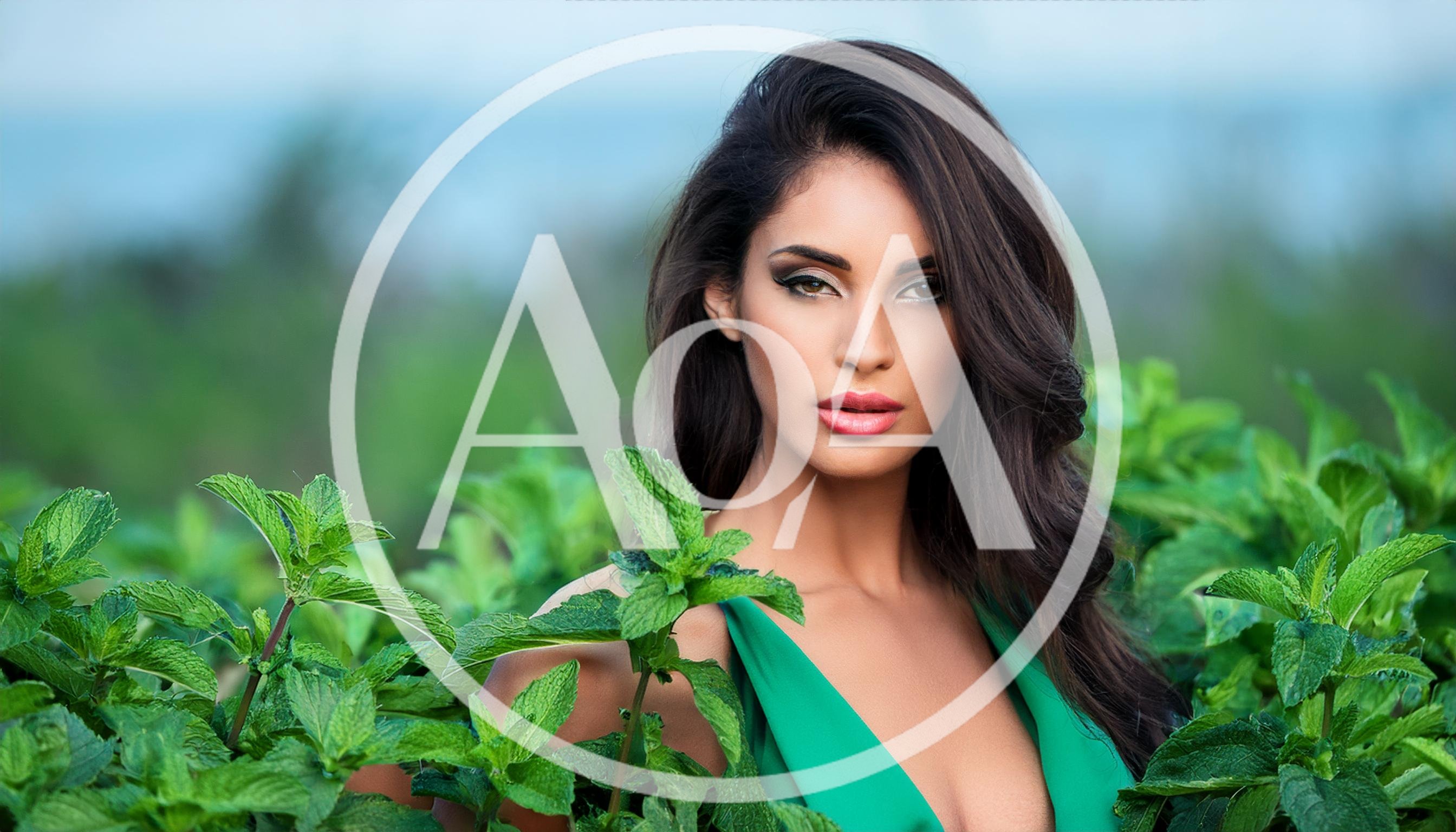 Beautiful Woman Posing In A Lush Mint Field