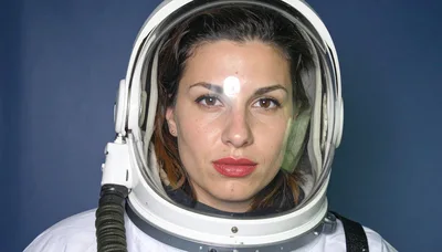 Portrait Of A Female Astronaut In A Space Helmet