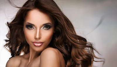 Portrait Of A Beautiful Woman With Long Wavy Hair