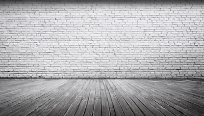 Empty Room With White Brick Wall And Wooden Floor
