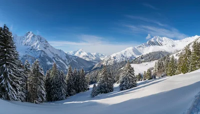 Panoramic View Of Snowy Alpine Mountains In Winter