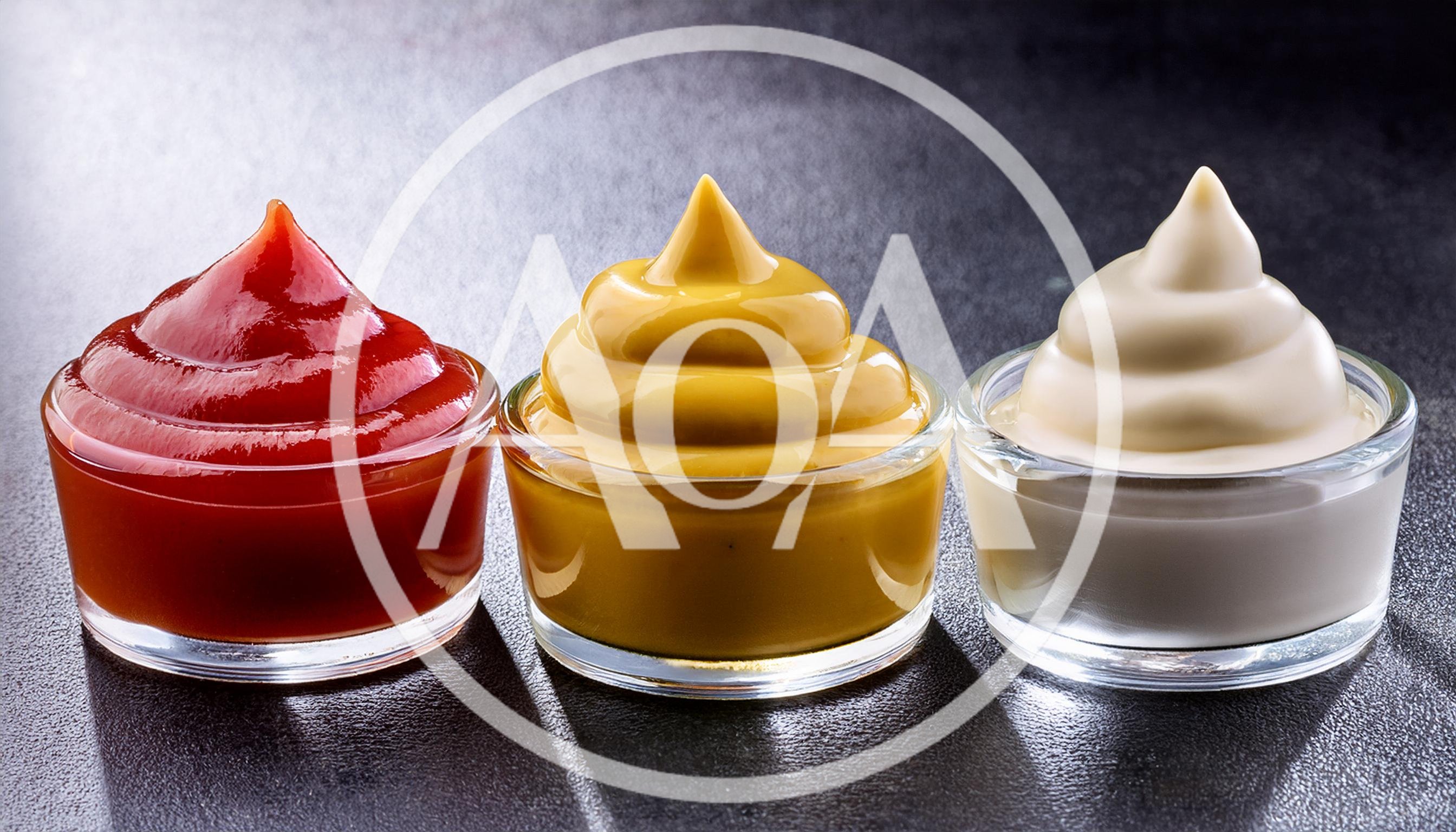 Three Glass Bowls With Ketchup Mustard And Mayonnaise