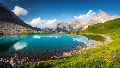 Turquoise Alpine Lake Surrounded By Rugged Mountain Peaks