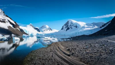 Antarctic Landscape With Glacial Mountains And Icebergs