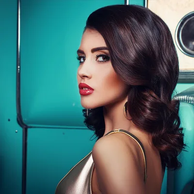 Glamorous Woman With Red Lips Posing In Gold Dress