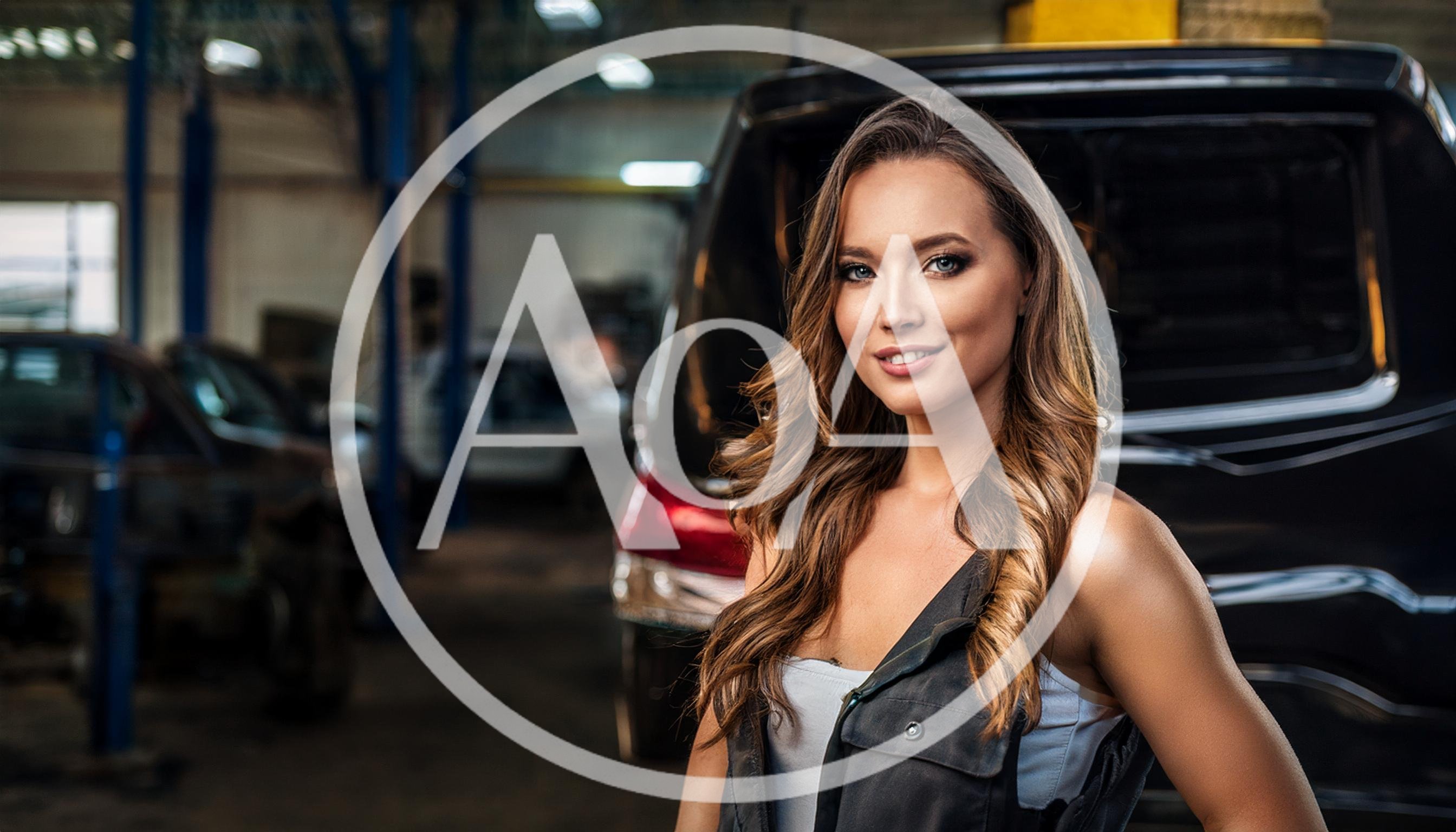 Female Mechanic Standing In A Professional Auto Repair Shop