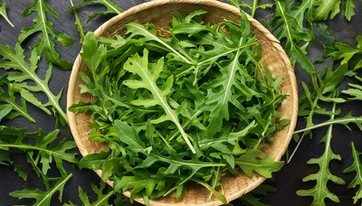 Fresh Arugula Leaves In A Woven Basket