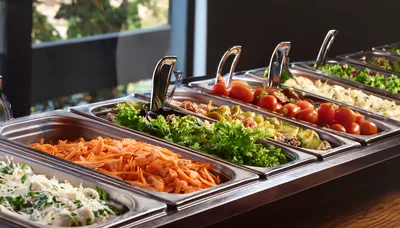 Salad Bar Buffet With Fresh Vegetables And Toppings