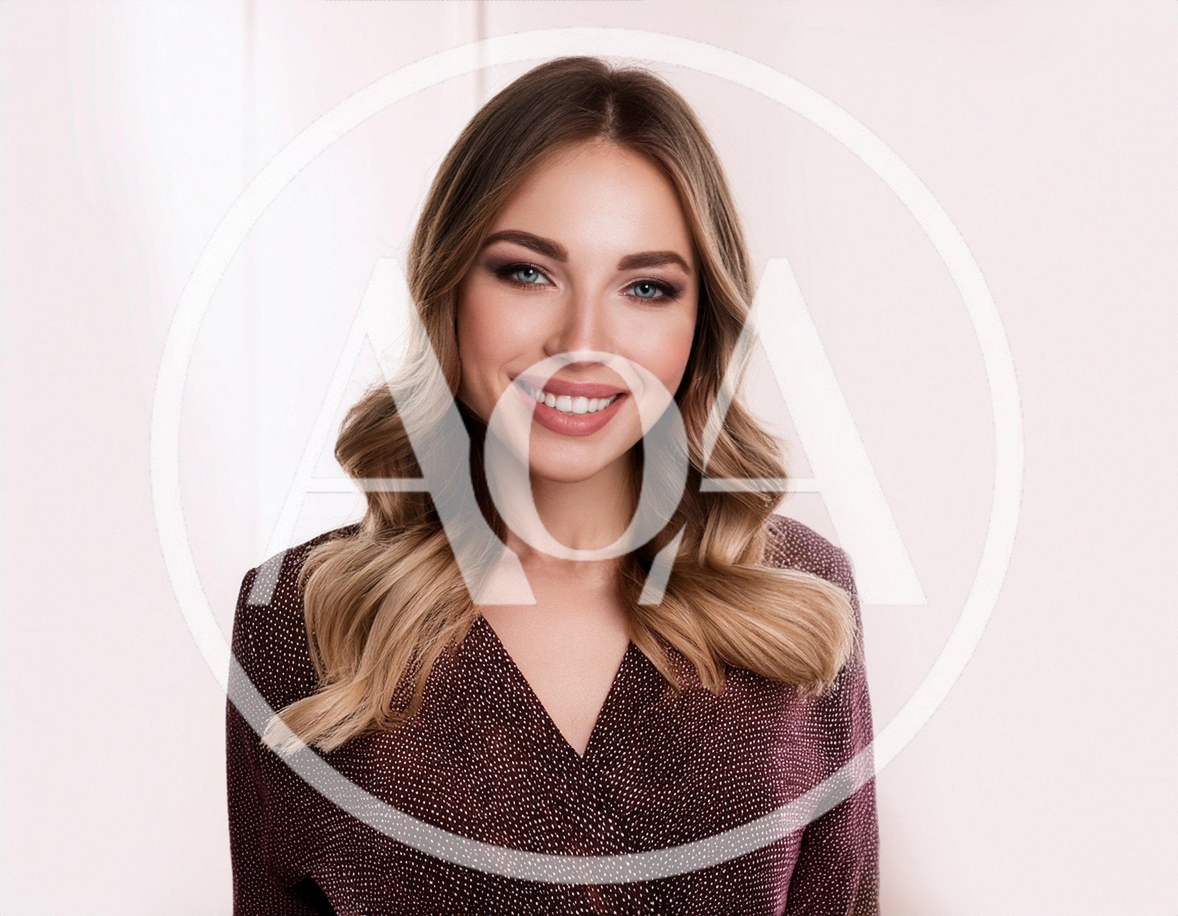 Portrait Of A Smiling Young Woman With Wavy Hair