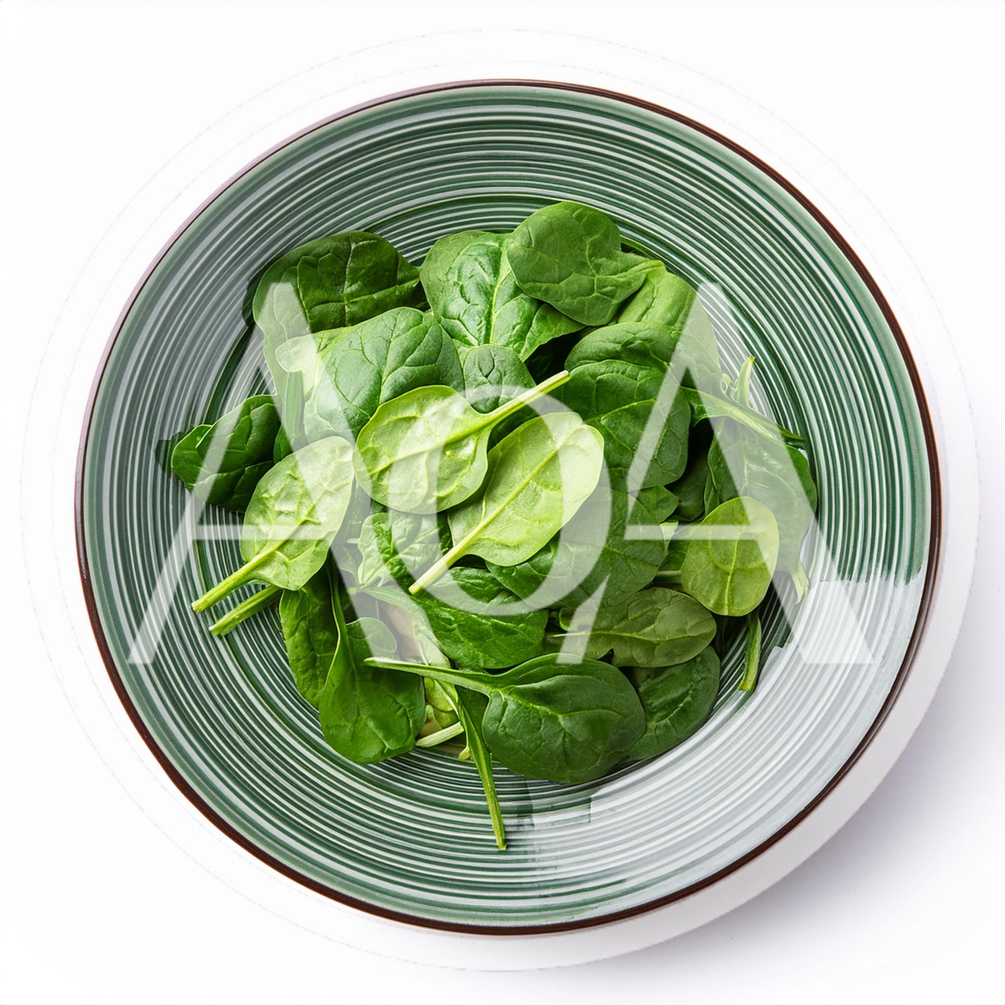 Fresh Green Spinach Leaves In A Striped Bowl