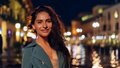Young Woman Smiling Outdoors at Night