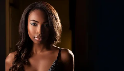 Portrait Of A Beautiful Young Woman With Long Hair
