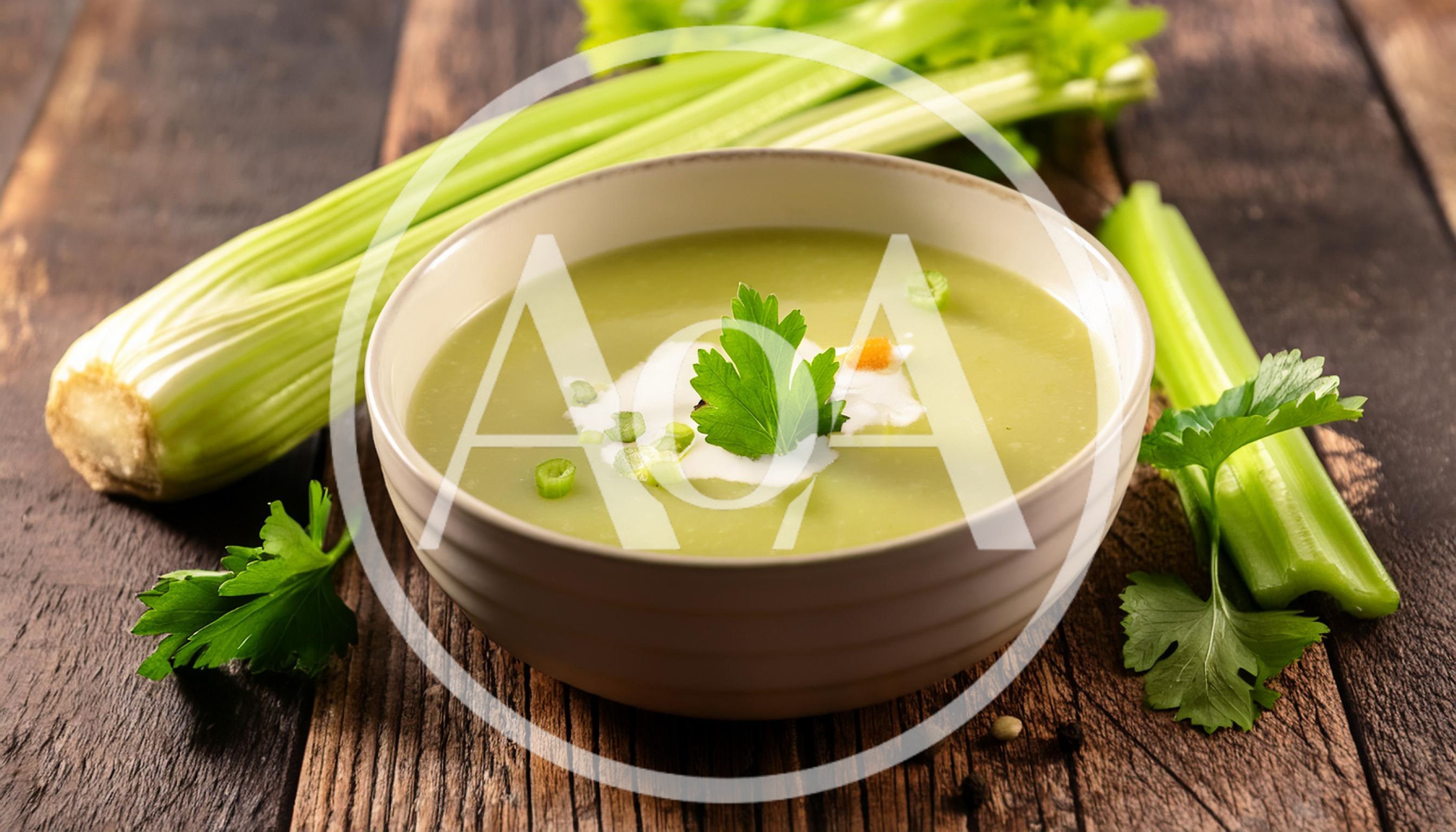 Bowl Of Creamy Celery Soup On Rustic Wooden Table