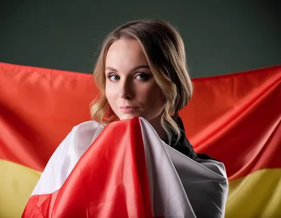 Young Woman Wrapped In A German Flag