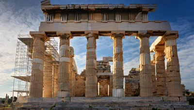 Ancient Greek Temple Ruins at Sounion Under Blue Sky