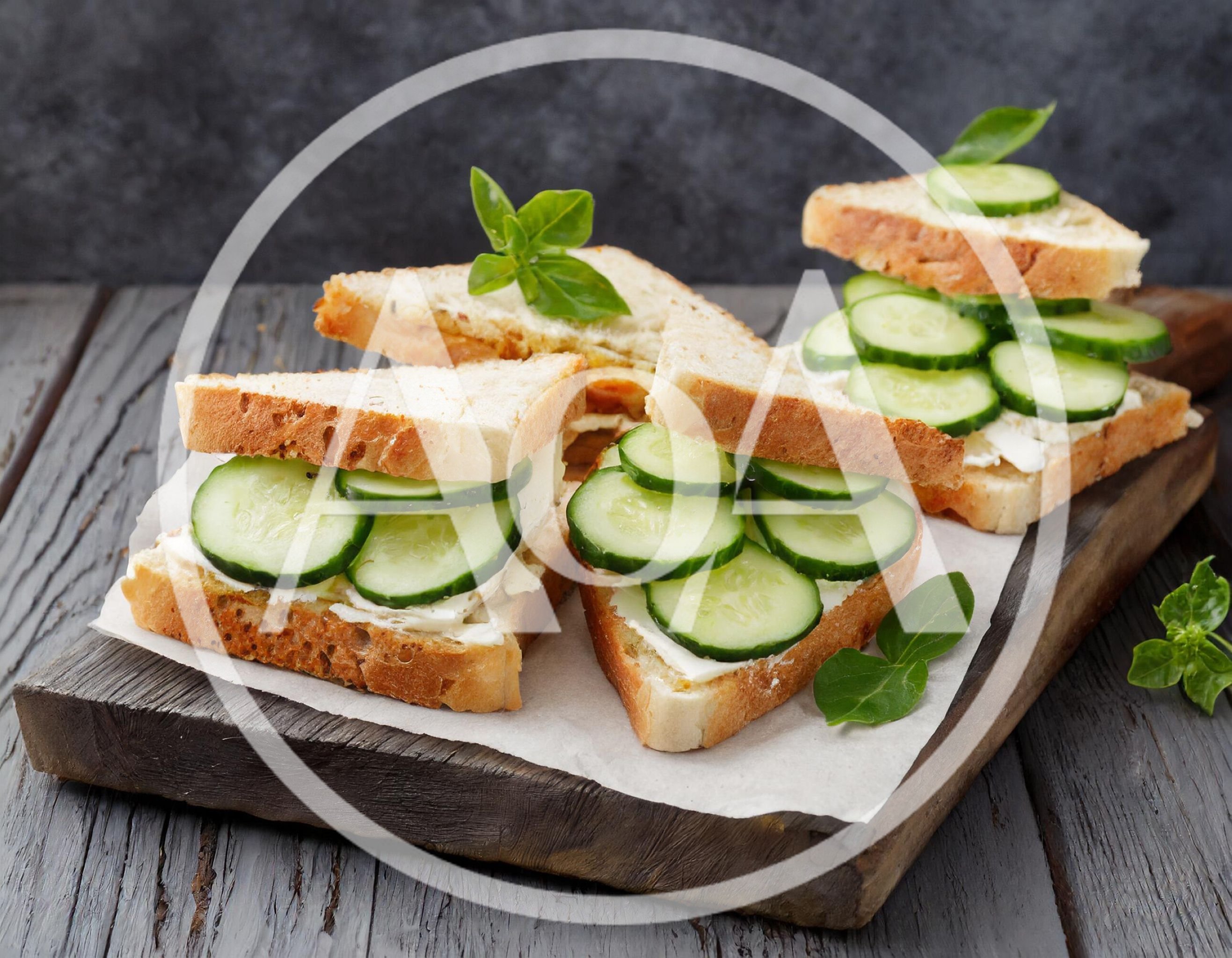 Fresh Cucumber Sandwiches On A Wooden Cutting Board
