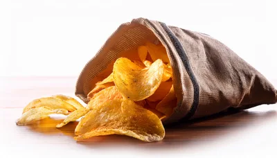 Potato Chips Spilling From A Fabric Bag