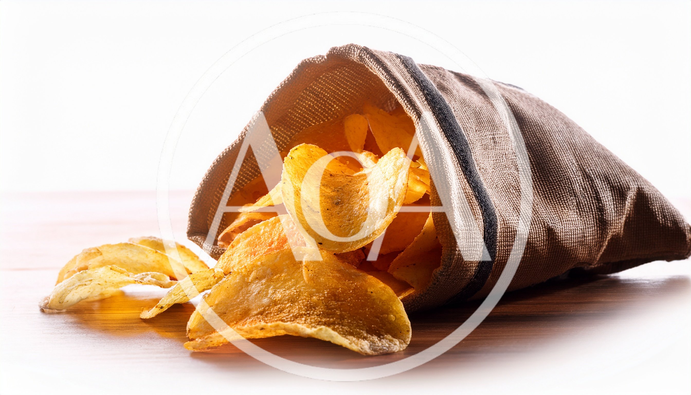 Potato Chips Spilling From A Fabric Bag
