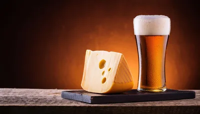 Wedge Of Swiss Cheese And Glass Of Beer