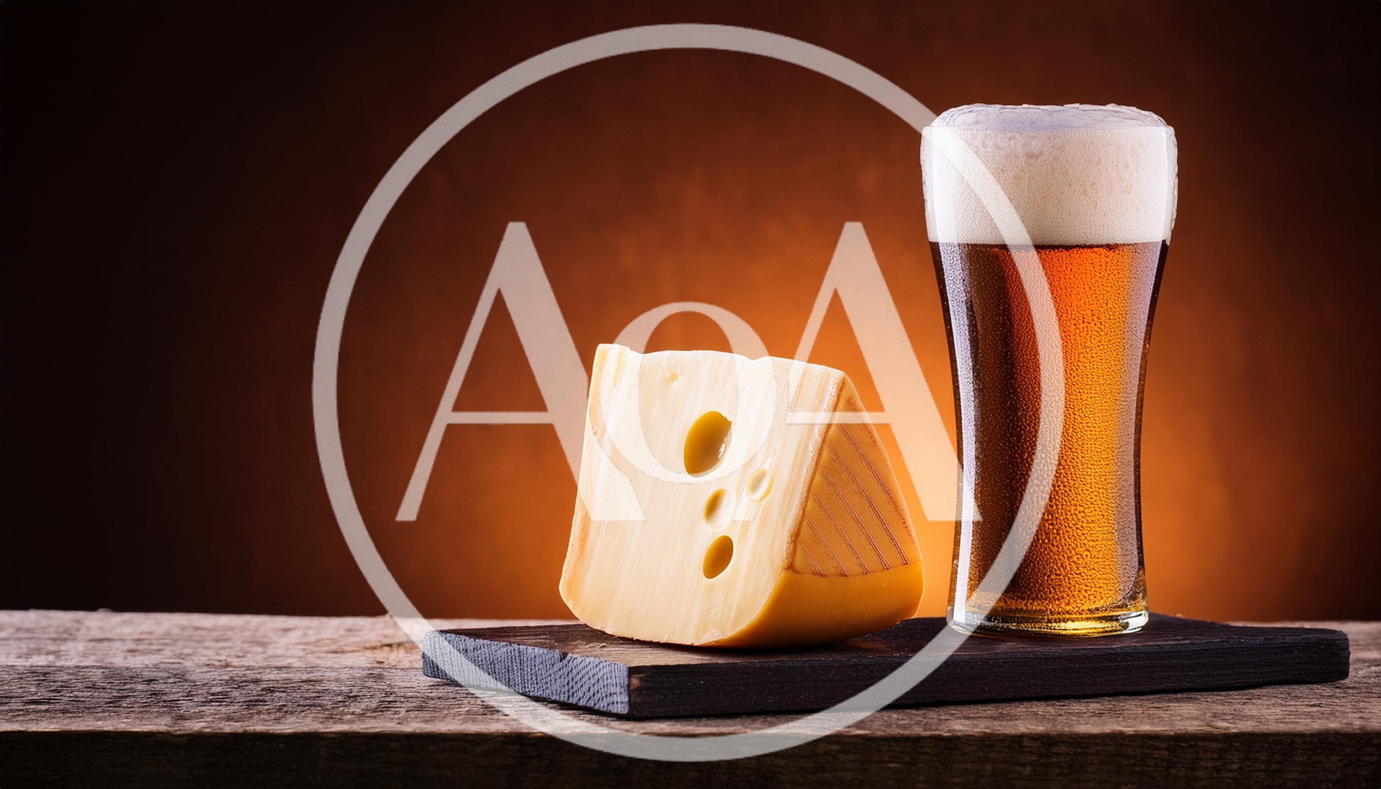 Wedge Of Swiss Cheese And Glass Of Beer