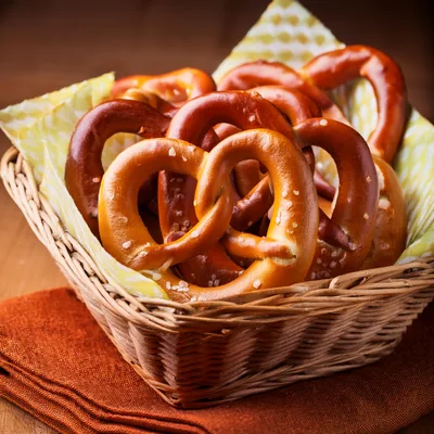 Freshly Baked Salted Pretzels In A Wicker Basket