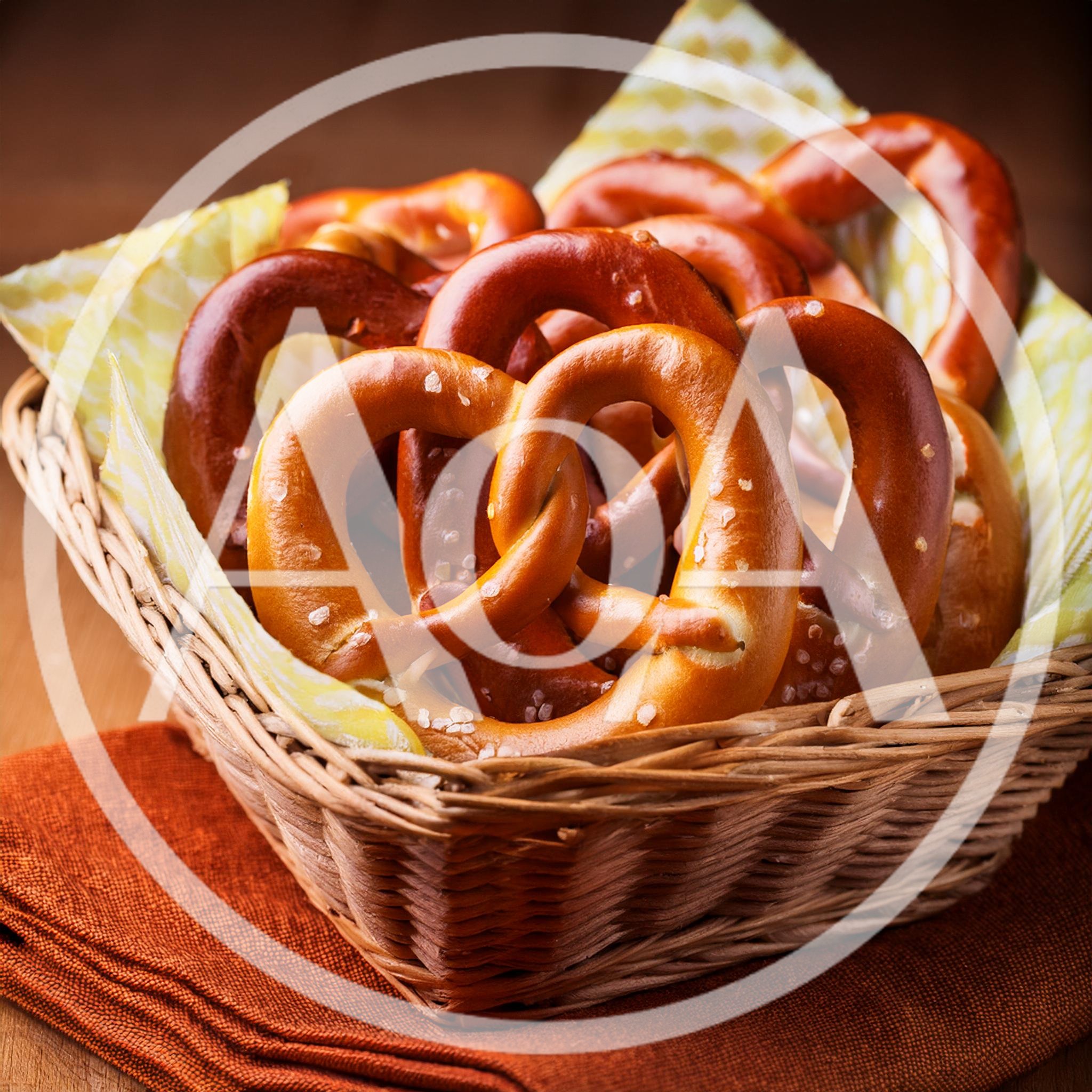 Freshly Baked Salted Pretzels In A Wicker Basket