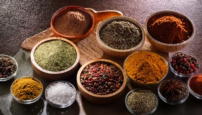 Assorted Spices and Herbs in Wooden Bowls