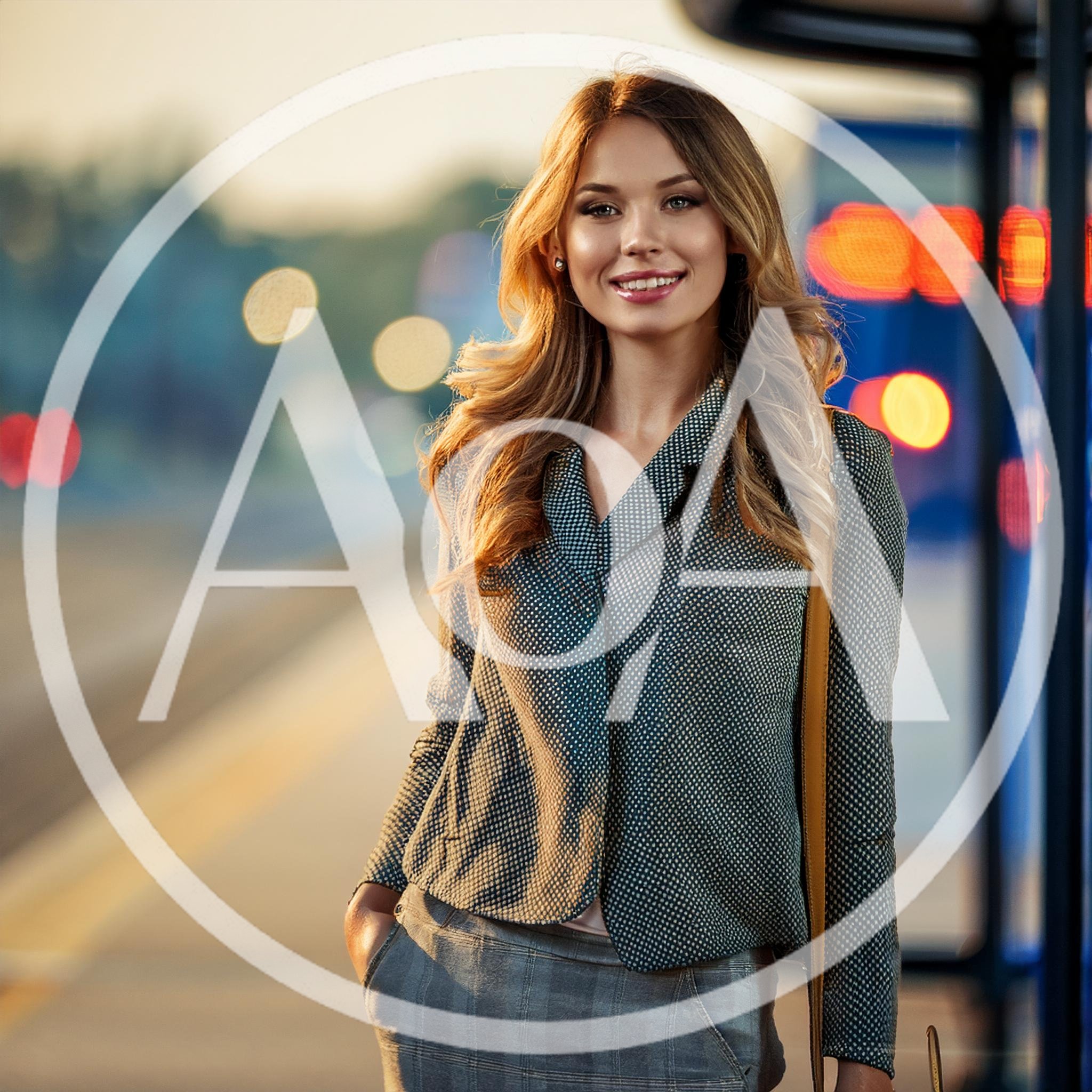 Young Woman Standing At A City Bus Stop