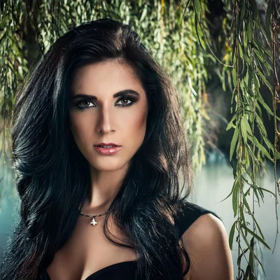 Portrait Of A Beautiful Woman With Long Dark Hair