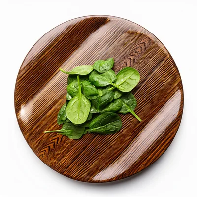 Fresh Green Spinach Leaves On A Wooden Plate