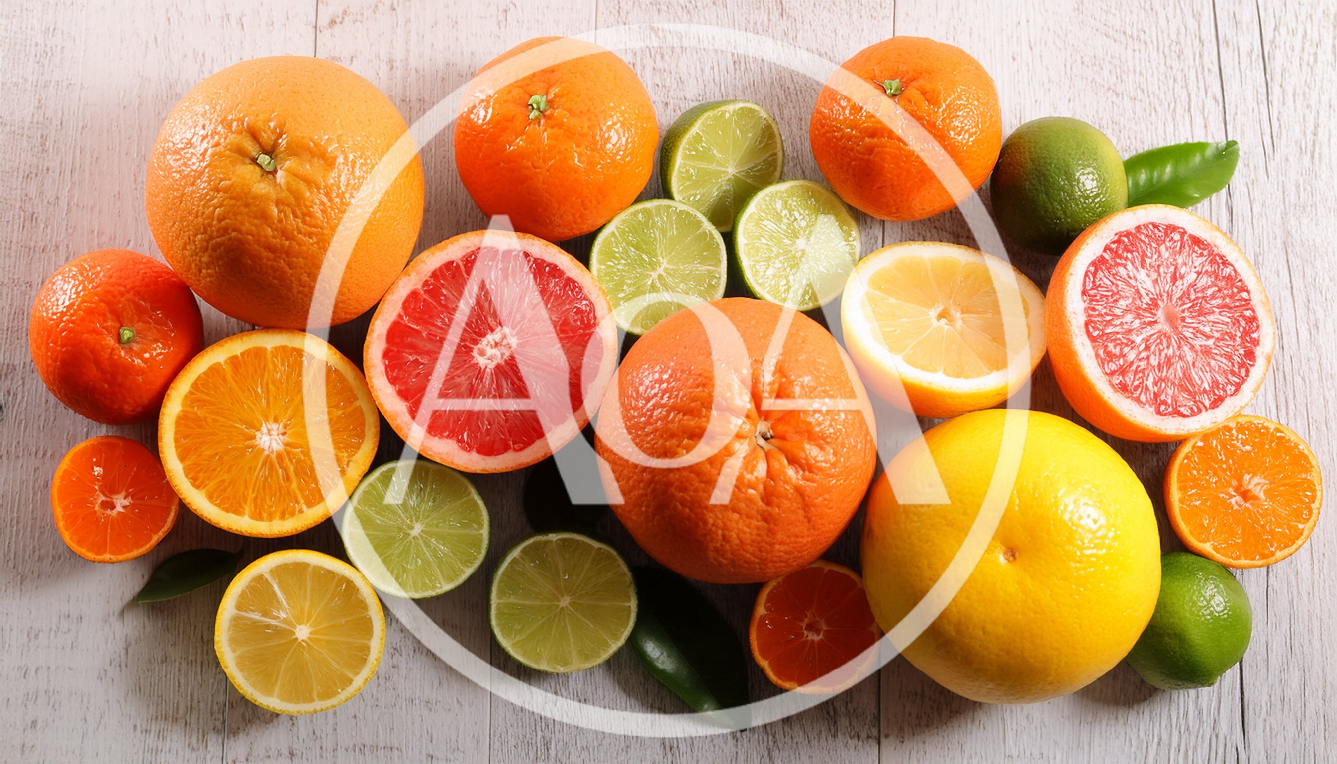 Assorted Fresh Citrus Fruits on Wooden Background