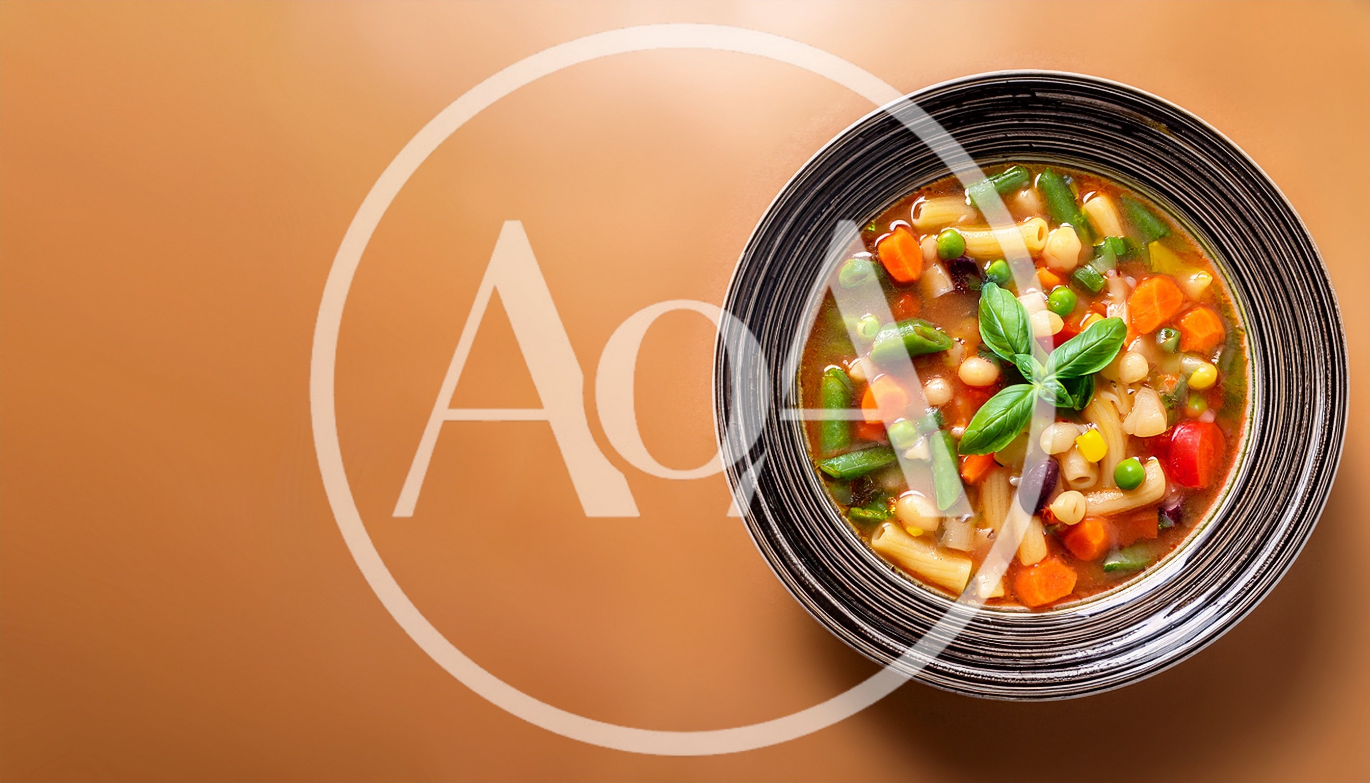 Bowl Of Minestrone Soup With Fresh Basil Garnish