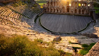 Ancient Roman Theater Ruins At Sunset In Hierapolis