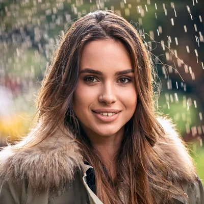 Portrait Of A Young Woman Standing In The Rain