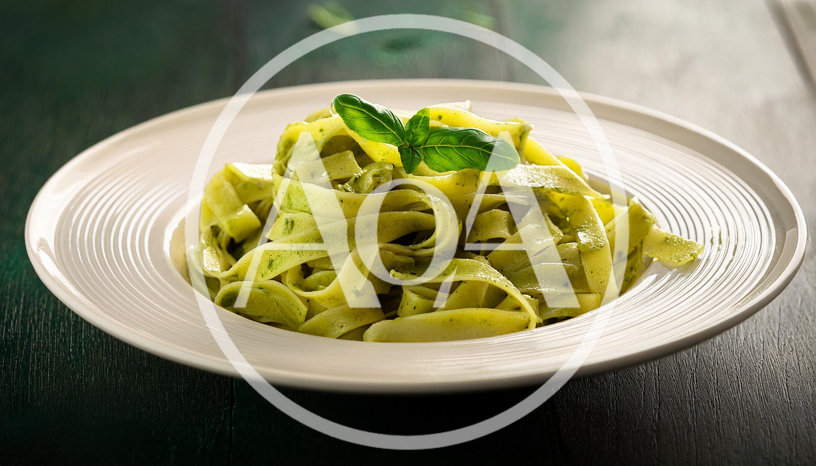 Plate Of Fresh Fettuccine Pasta With Pesto Sauce