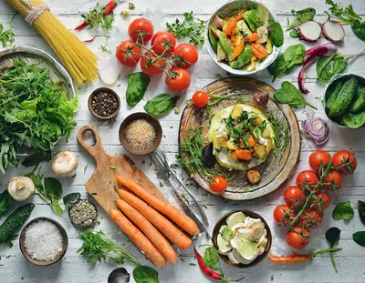 Fresh Vegetables And Pasta Ingredients On White Wooden Table