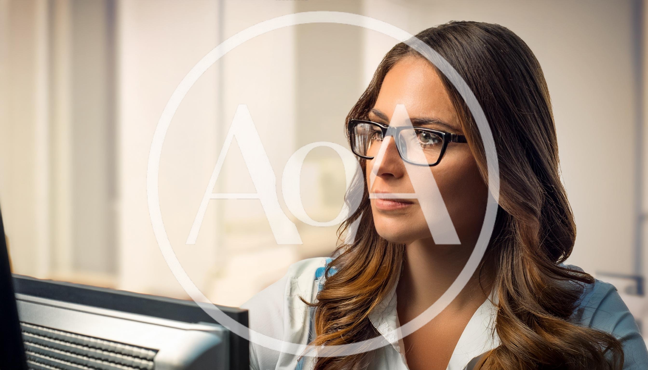 Professional Woman Working At Computer In Office