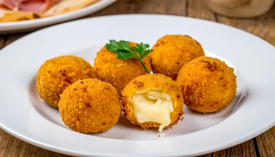 Fried Cheese Balls on a White Plate