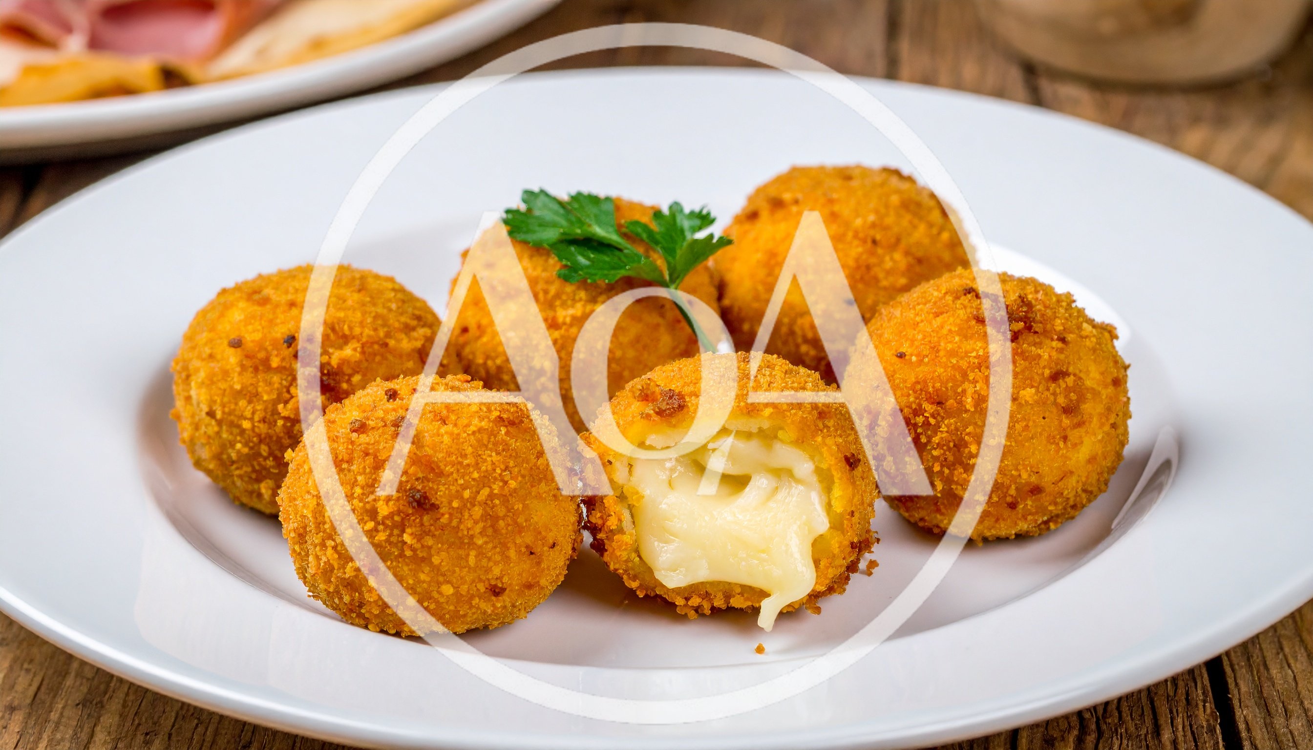Fried Cheese Balls on a White Plate
