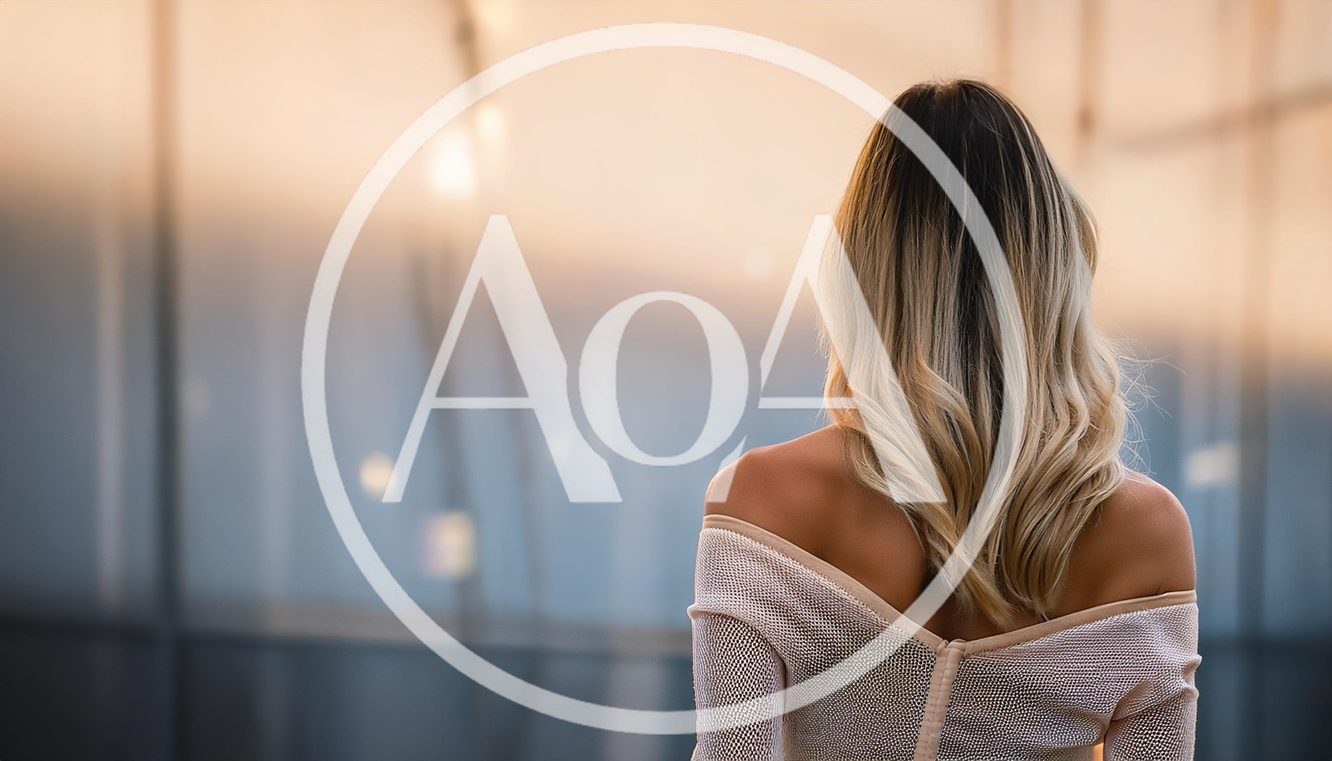 Woman With Blonde Hair Looking Out A Window