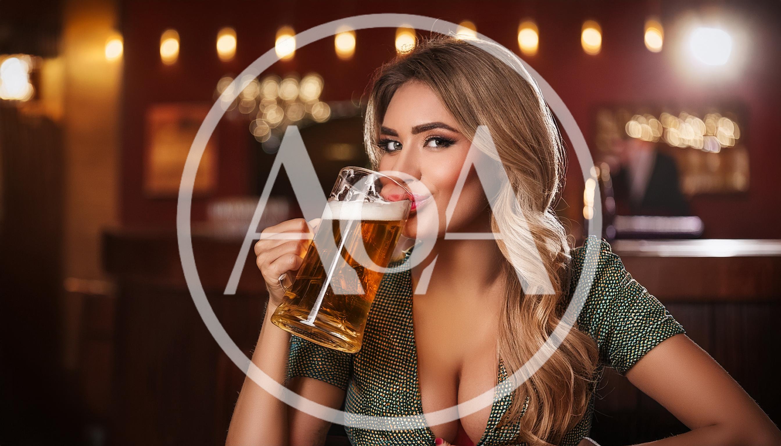 Beautiful Woman Drinking Beer in a Pub