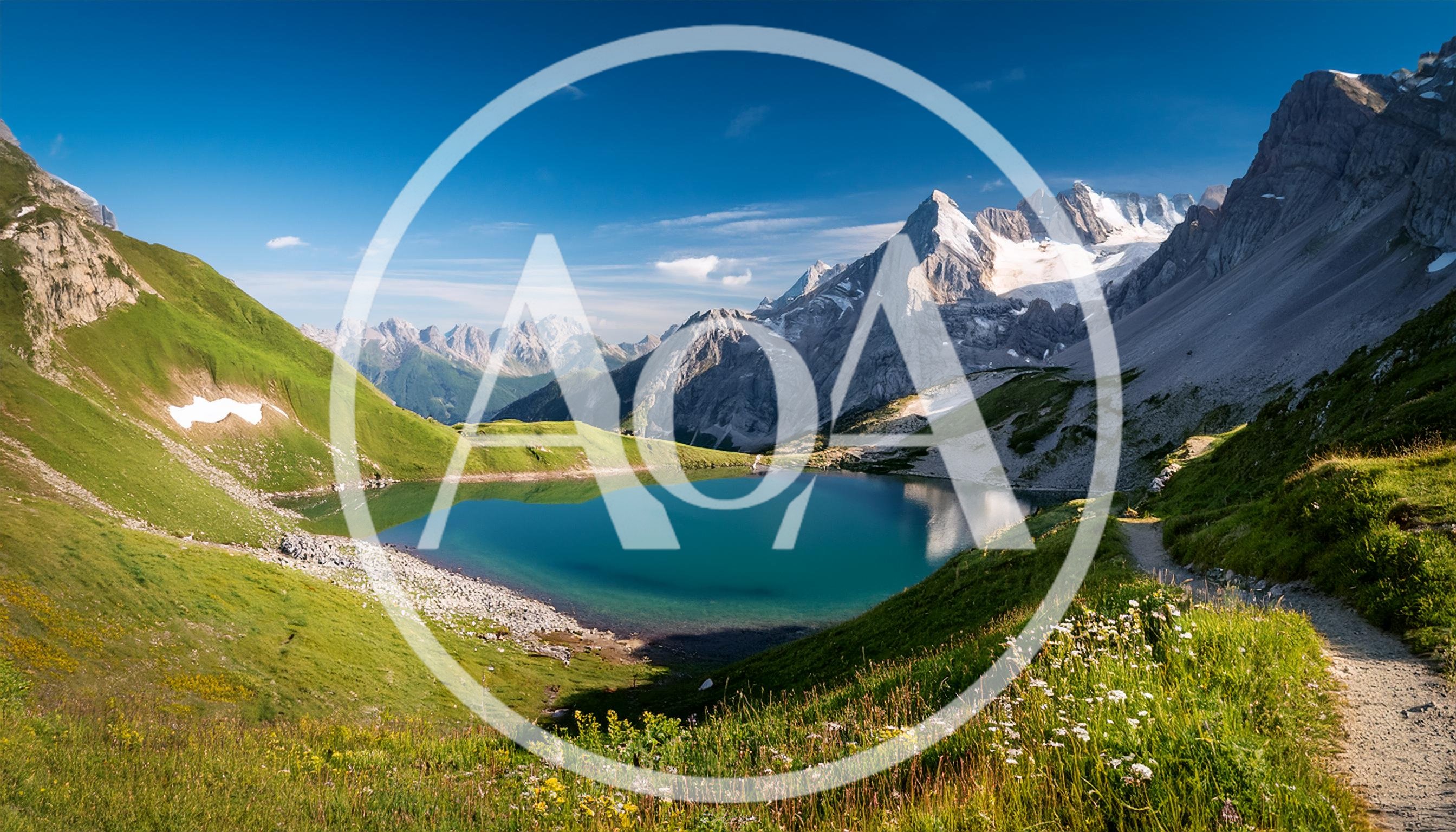 Alpine Lake Surrounded By Snow Capped Mountains