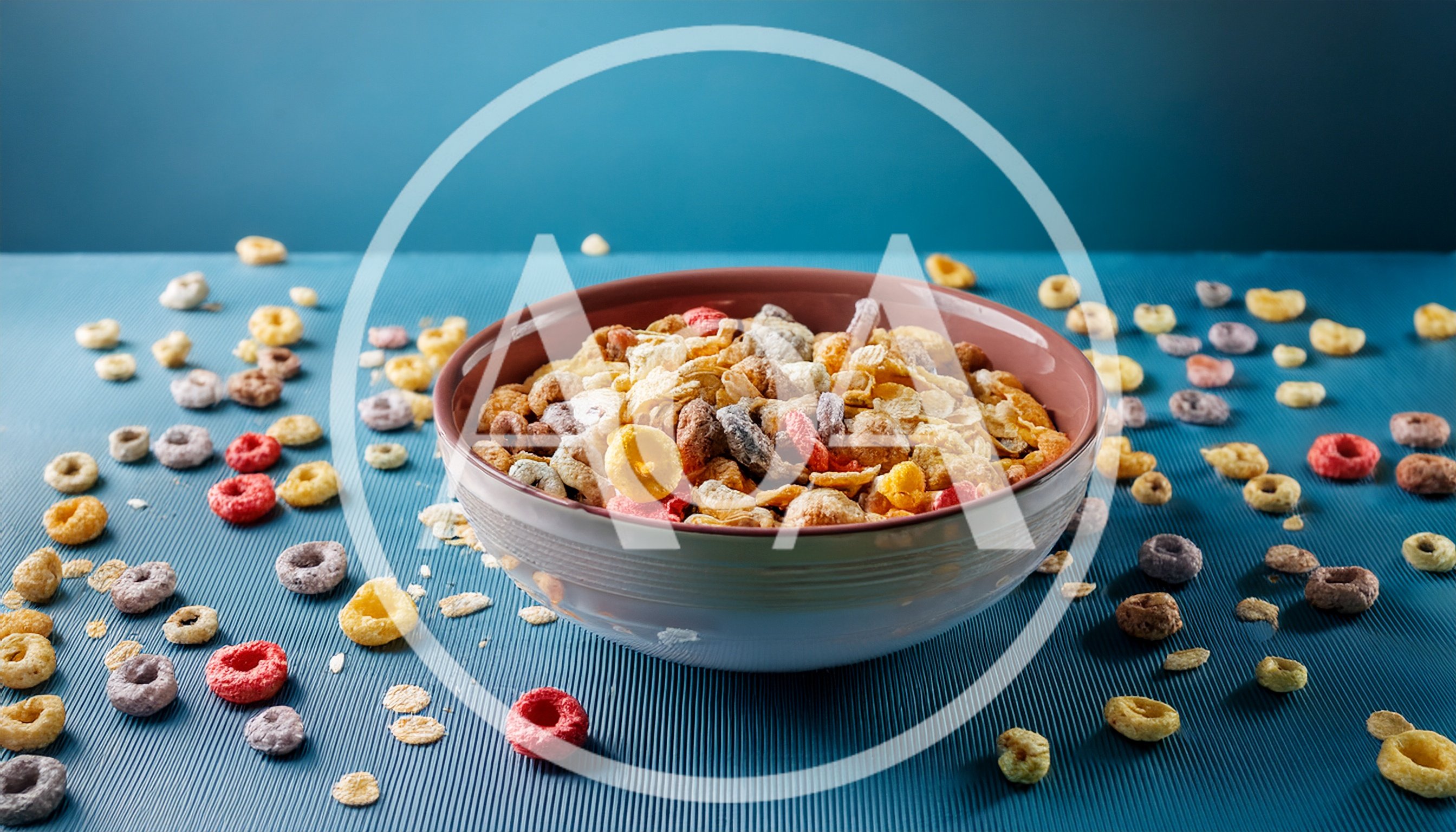Bowl of Colorful Breakfast Cereal on Blue Surface