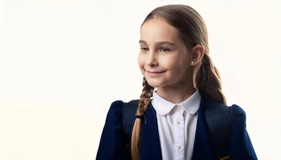 Young Schoolgirl With Braided Hair Wearing Uniform