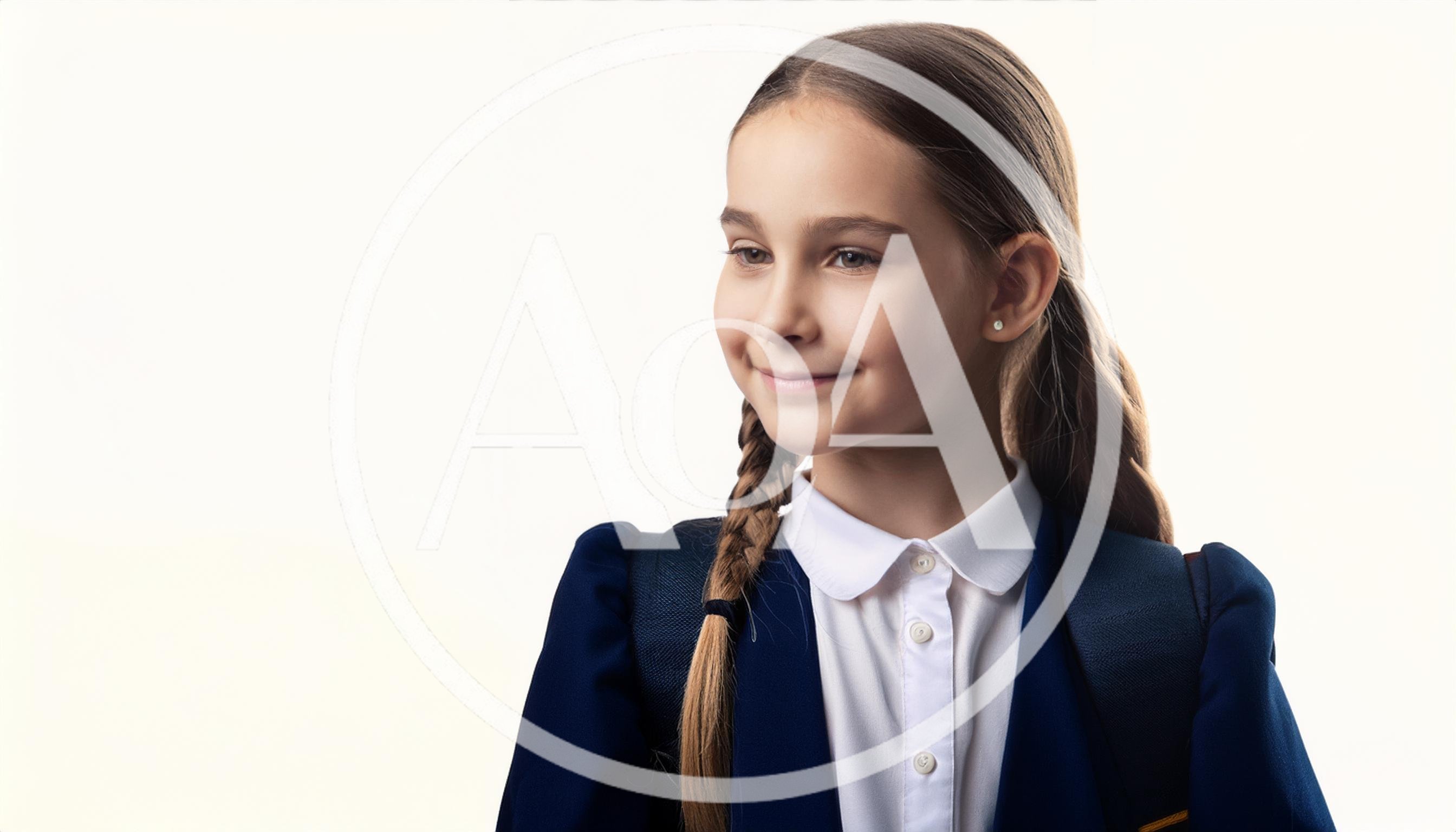 Young Schoolgirl With Braided Hair Wearing Uniform