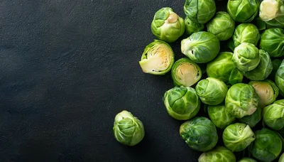 Fresh Green Brussels Sprouts on Dark Textured Background